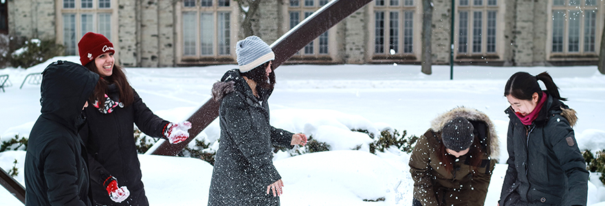 Students play in the snow